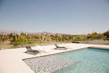 Swimming pool overlooking tree and mountains