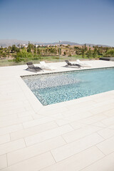 Swimming pool overlooking tree and mountains