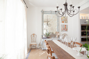 Chandelier over dining table in luxury dining room