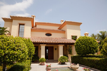 Potted plants in formal garden outside villa