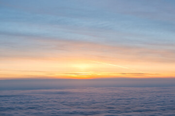 Naklejka na ściany i meble Colorful sky and cloud seen from window of airplane