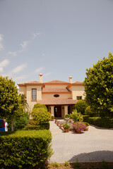 Potted plants in formal garden outside villa