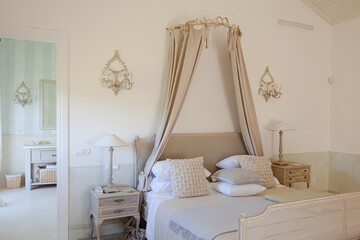 Bed with canopy in luxury bedroom