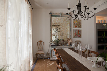 Chandelier over dining table in luxury dining room