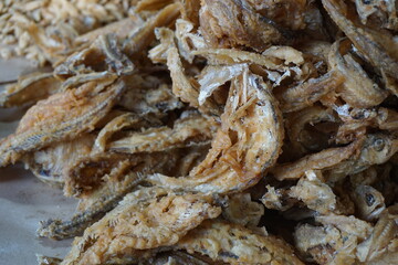 Fried fish with a natural background. Indonesian fried fish covered with flour, usually use small fish. This food also called wader goreng