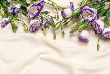delicate blue flowers on an ivory fabric background