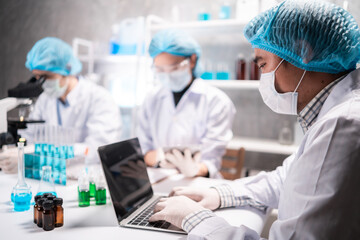 Health care researchers working in life science laboratory, medical science technology research...