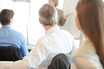 Fototapeta premium Business people sitting in meeting