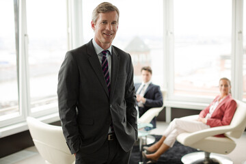 Businessman smiling in meeting