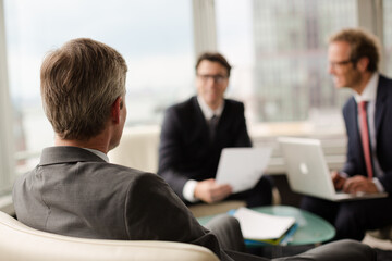 Fototapeta premium Businessmen sitting in meeting