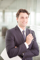 Businessman sitting on sofa in office lobby