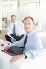 Businessmen sitting in meeting