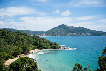 Beautiful coastline blue water cliffs and mountains background.Waves slow motion splashing against the shore.