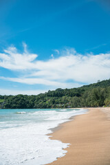 waves nature splashes sand beach on sunlight.blue sea and sky famous beach.
