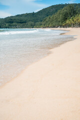 waves nature splashes sand beach on sunlight.blue sea and sky famous beach.