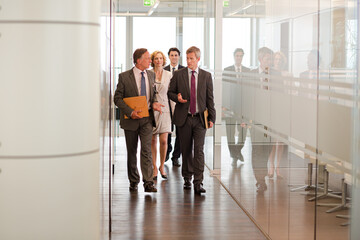 Business people talking in office lobby