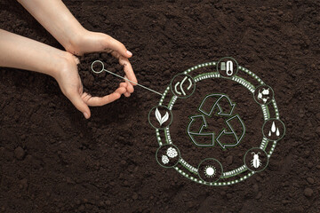 hands with soil on the background of the earth, bio icon, the concept of biodegradable materials, waste-free, eco-friendly recycling, natural fertilizers, organic products and eco friendly farming