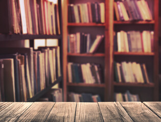 Empty wooden table in library. Space for design