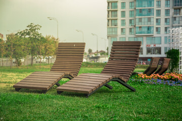 chaise longue in the city park, a place for sunbathing in the city