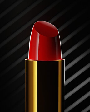 Red lipstick in golden tube on the dark background with stripes. Closeup high quality photo
