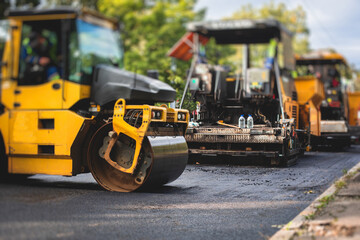 Process of asphalting, blacktopping and paving, asphalt paver machine and steam roller compactor...