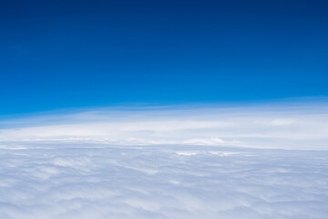 Fototapeta na wymiar Aerial view scene of the white fluffy clouds and blue bright sky background