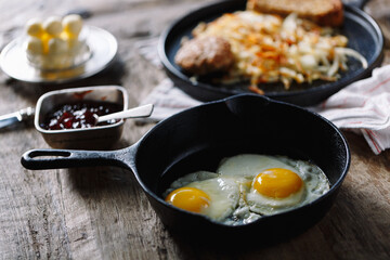 Breakfast fried eggs and hashbrowns