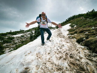 Happy hiker who achieved the peak of the Monte Baldo