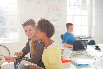 Business people using digital tablet in office