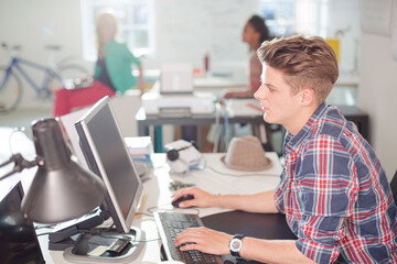 Businessman working at computer at desk