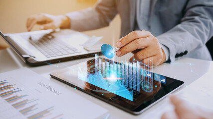 Hand of businessman interaction with artificial intelligence to invest bitcoin price digital chart exchange on tablet. Concept of cryptocurrency future money and nft of blockchain technology.