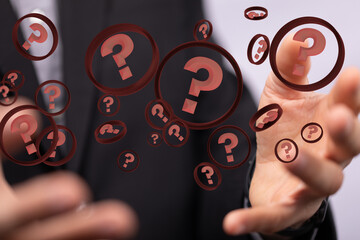 Businessman solving problem with digital question marks 3D rendering
