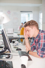 Businessman working at computer at desk