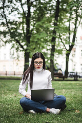 Caucasian Student girl working with a laptop