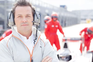Photo sur Plexiglas F1 Race manager wearing headphones on track