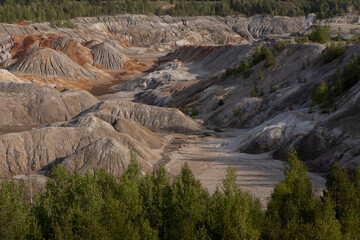 The clay quarry resembles a cosmic landscape.Ural Mars.An original landscape in the Sverdlovsk region in Russia.Top view of the hills made of refractory clay.A unique place created by man and nature