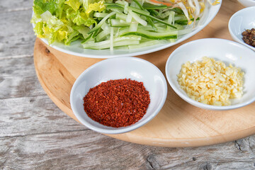 Spices and herbs on wooden table. Food and hot pot ingredients
