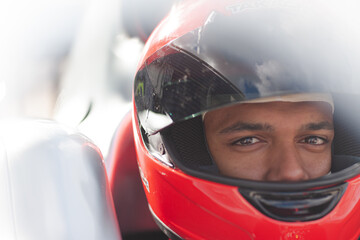 Fototapeta premium Close up of racer wearing helmet