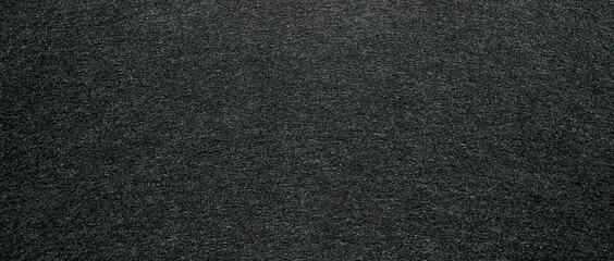 Black rectangular texture of the granite background, an empty space for the inscription. Banner format