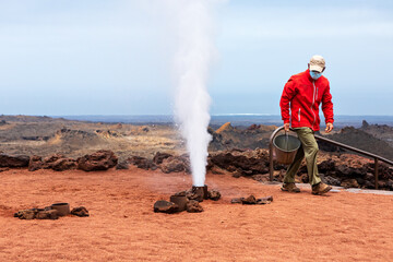 Geyser of steam, in Timanfaya National Park, Lanzarote, Canary Islands, Spain