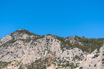 view of tunektepe, taurus mountains,  blue sky background. antalya, turkey,