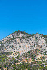 view of tunektepe, taurus mountains,  blue sky background. antalya, turkey,