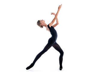 young ballerina in black pointe shoes and leotards posing in graceful pose, isolated on white background