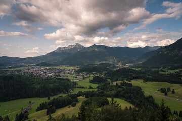 Fototapeta na wymiar Alpine green landscape in summer on a cloudy day, Reutte, Austria