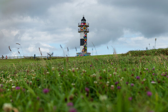 lighthouse of cabo de ajo painted by the artist Okuda in Cantabria