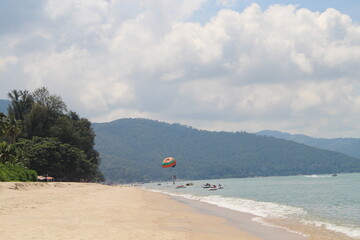 Obraz premium paragliding in the beach paradise