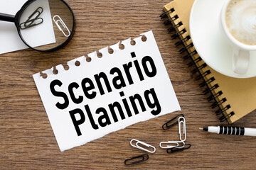Scenario Planning, text on wood table, on white paper