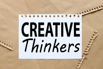 Creative Thinkers. text on white notepad paper on craft background