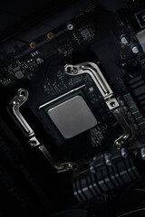 Fototapeta premium Silver computer processor on a black motherboard