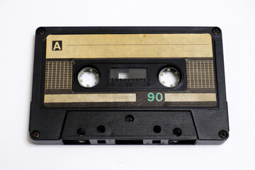 Obraz premium Old audio cassette on a white background. Compact cassette